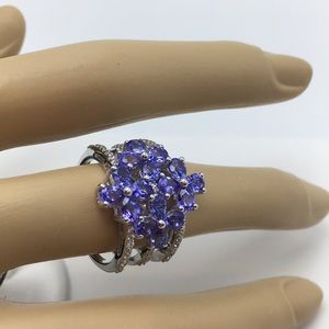 GEM TREASURES S S TANZANITE & WHITE ZIRCON RING